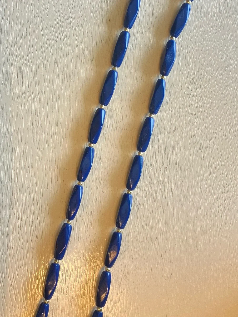 Mod retro dark blue vintage lucite necklace with gold spacer beads